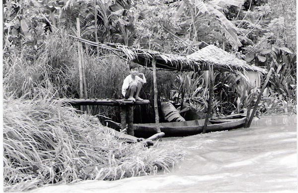 Mekhong Delta - boy on dock